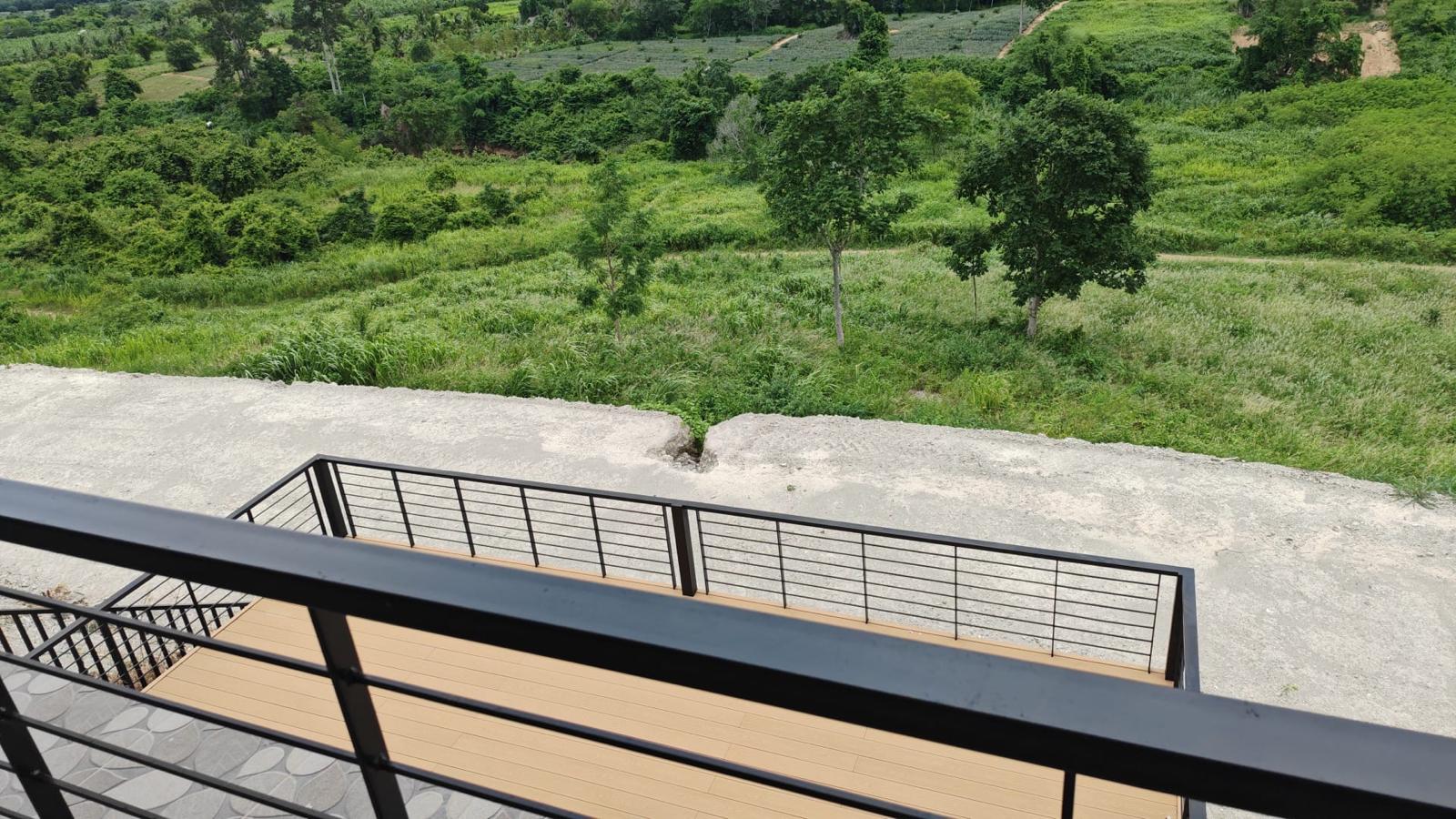 View down from the balcony over the land