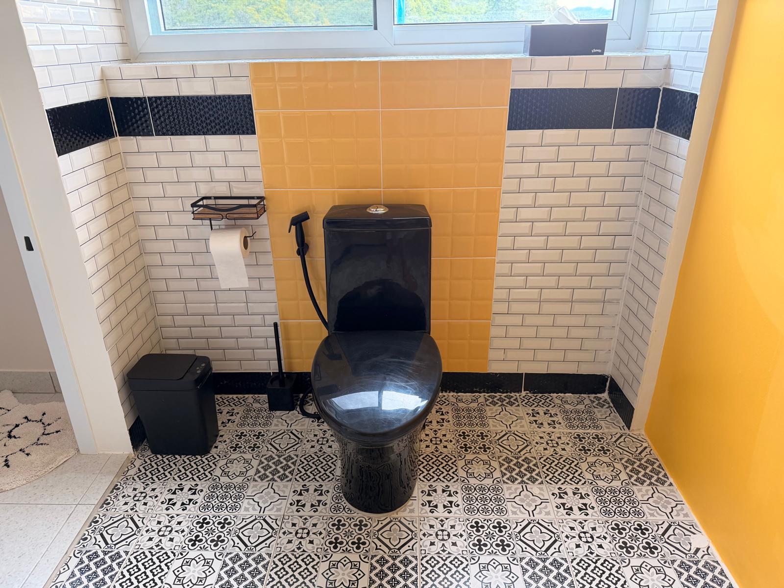 Finished bathroom with patterned tile