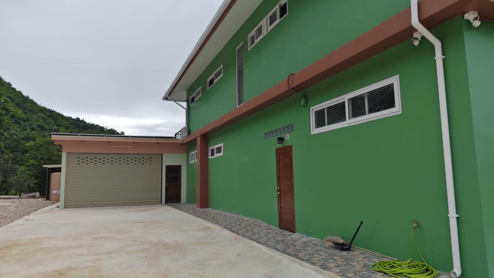 Full view of the house and garage from the driveway